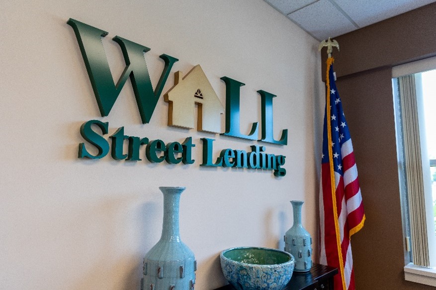 Office wall logo for Wall Street Lending in Michigan